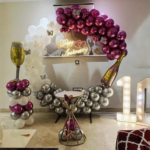 Luxury Anniversary Balloon Decoration Package | Wine Bottle Theme, Neon Light & Silver–Maroon Balloon Arch