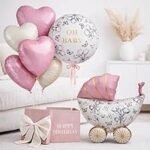 Elevate your baby shower or welcome baby party with this 7-piece pastel pink & cream foil balloon set, featuring a cradle centerpiece and 'Oh Baby' accent balloon.